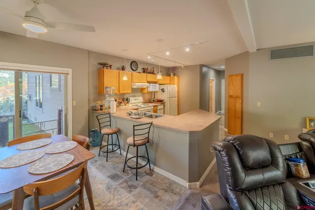 a room with dining table and chairs