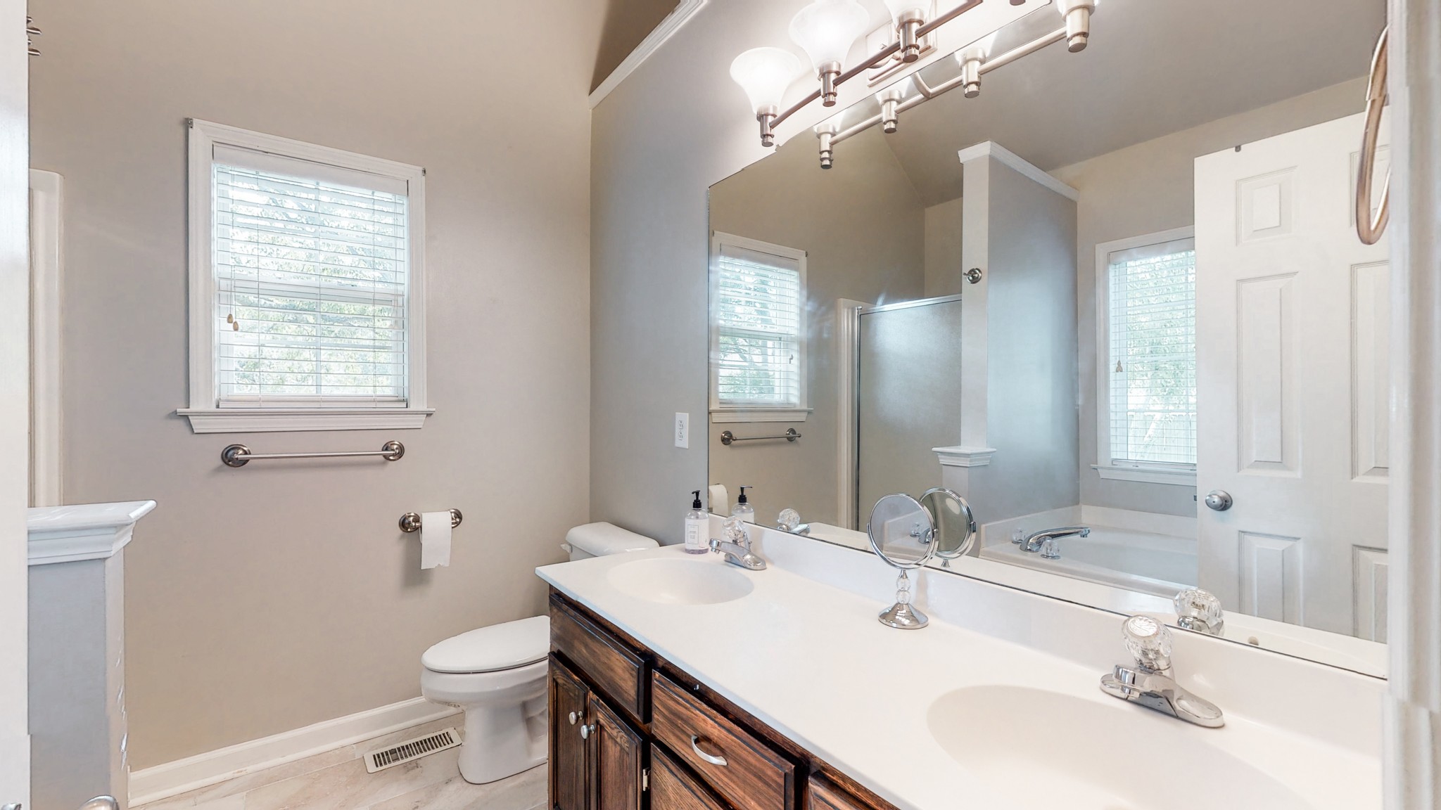 2804 Rippavilla Way Spring Hill, TN 37174 - Photo 9 of 18 a bathroom with a sink a toilet and a mirror