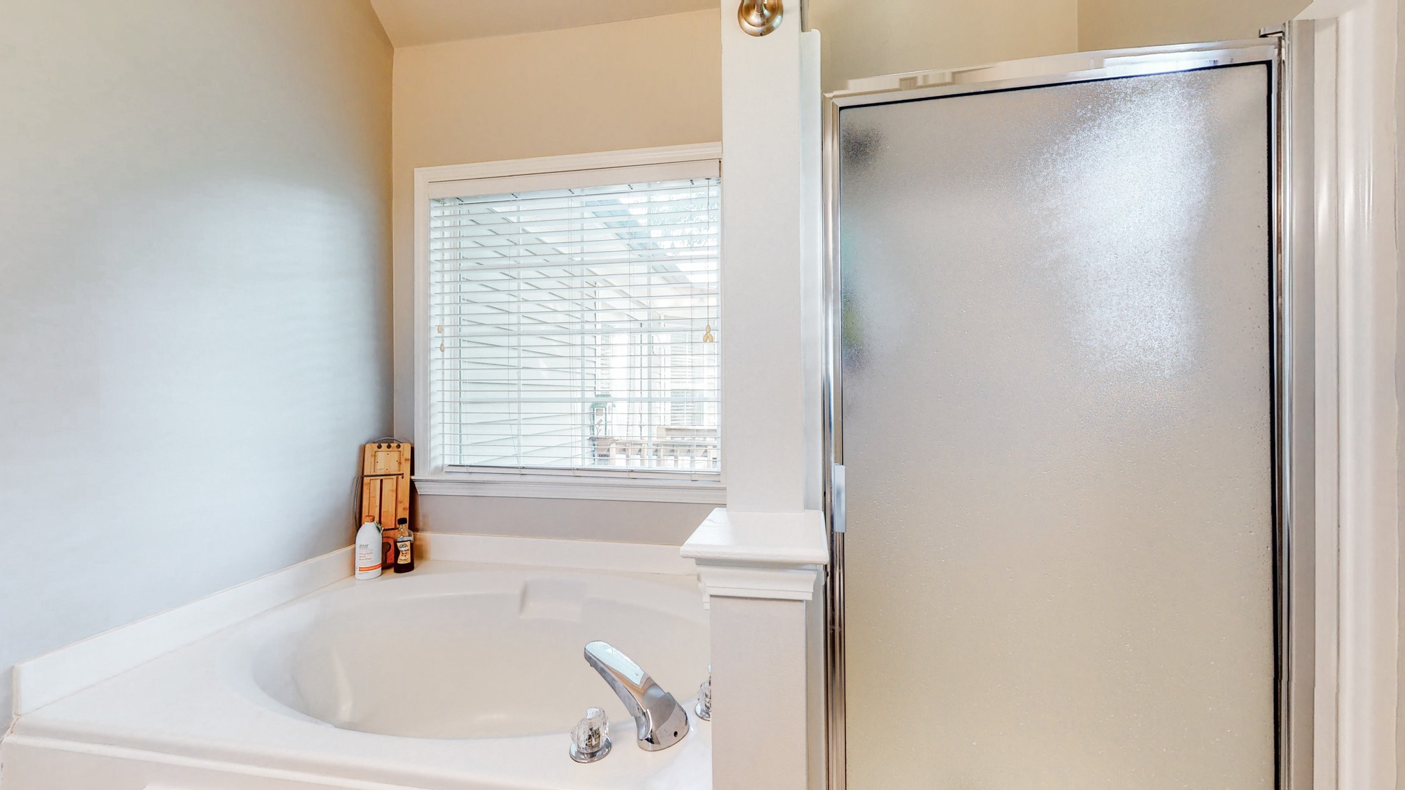 2804 Rippavilla Way Spring Hill, TN 37174 - Photo 10 of 18 a bathroom with a tub and a sink