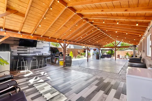 a view of a studio with wooden floor