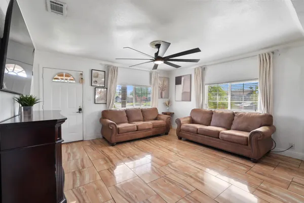 a living room with furniture and a large window