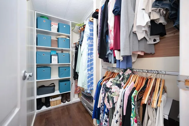 a bathroom with a granite countertop sink mirror and a bathtub