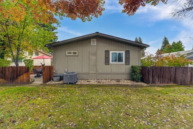 an aerial view of a house with a garden and swimming pool