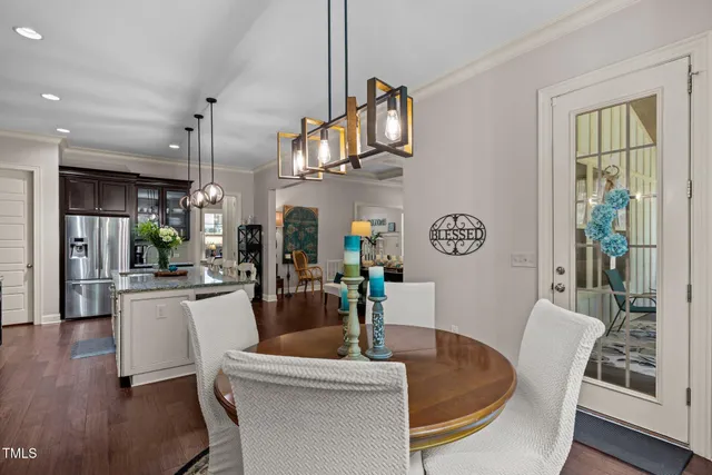 a living room with furniture a window and kitchen view