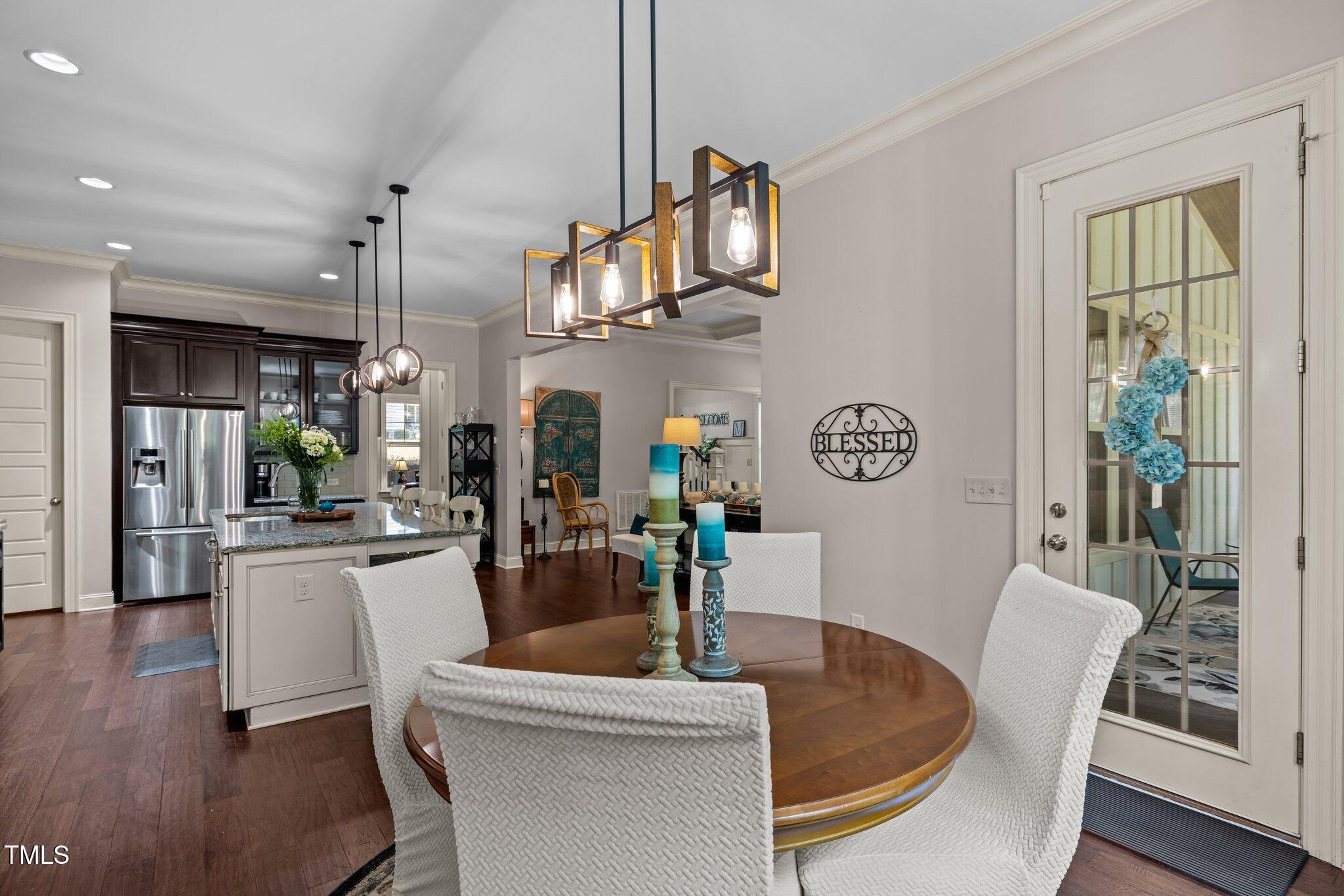 12216 Kyle Abbey Lane Raleigh, NC 27613 - Photo 8 of 60 a living room with furniture a window and kitchen view