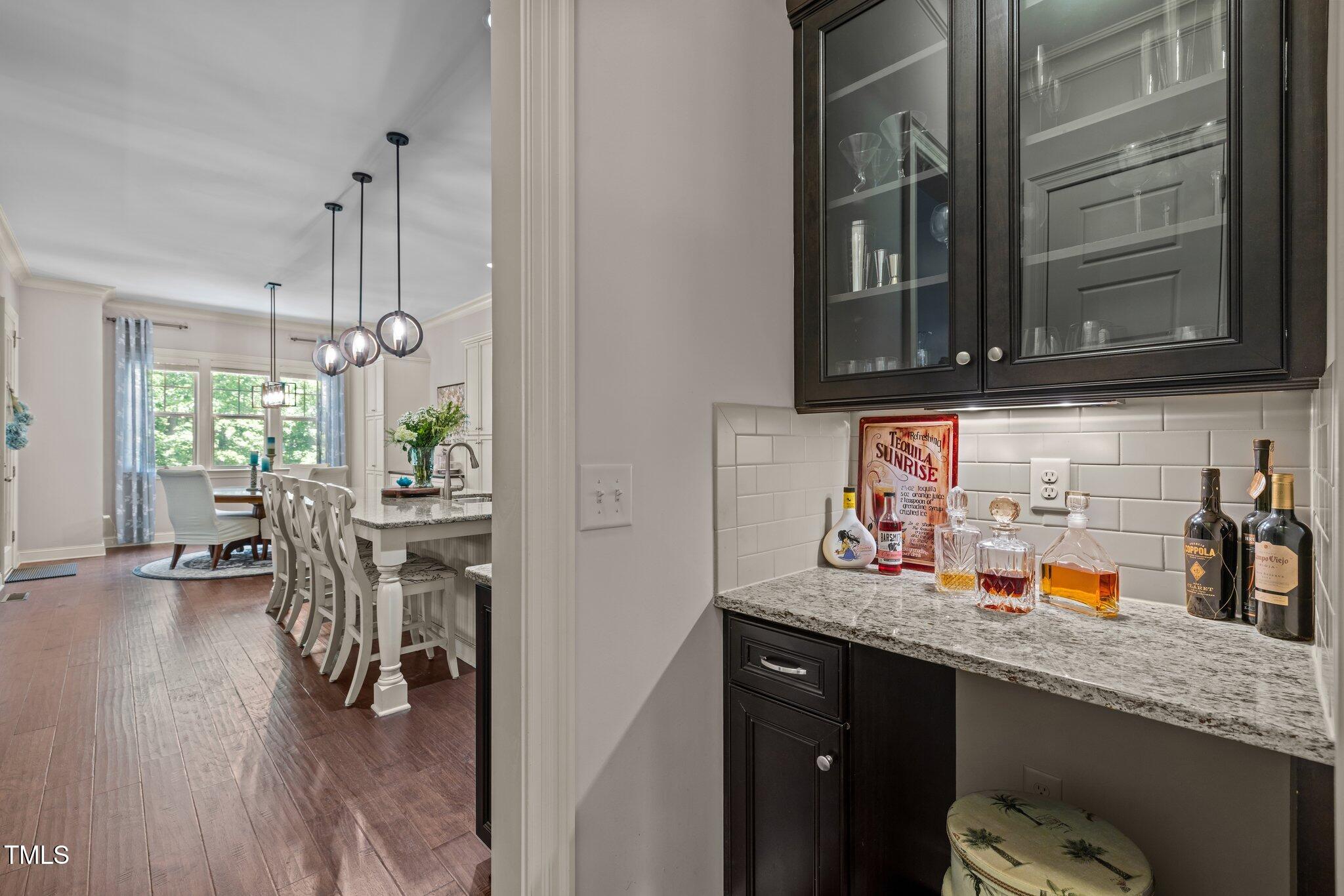 12216 Kyle Abbey Lane Raleigh, NC 27613 - Photo 9 of 60 a kitchen with a sink cabinets and window