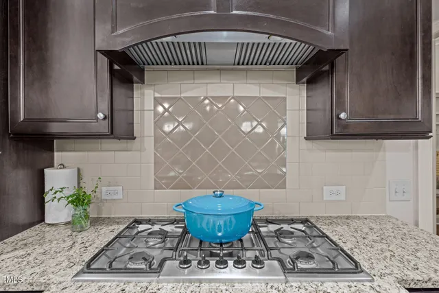 a view of a wooden cabinets and a potted plant