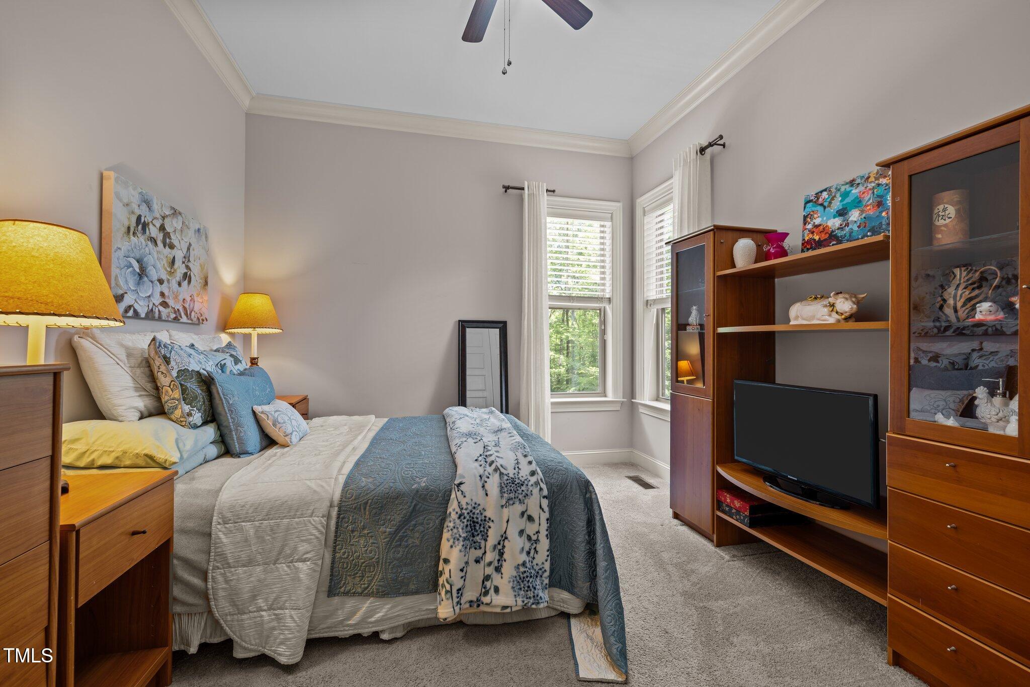 12216 Kyle Abbey Lane Raleigh, NC 27613 - Photo 12 of 60 a bedroom with a bed and a window