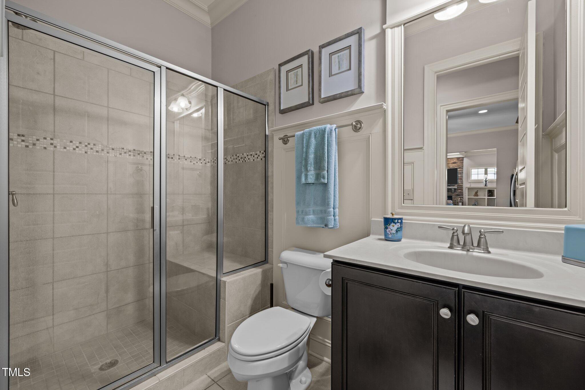 12216 Kyle Abbey Lane Raleigh, NC 27613 - Photo 13 of 60 a bathroom with a sink toilet and shower