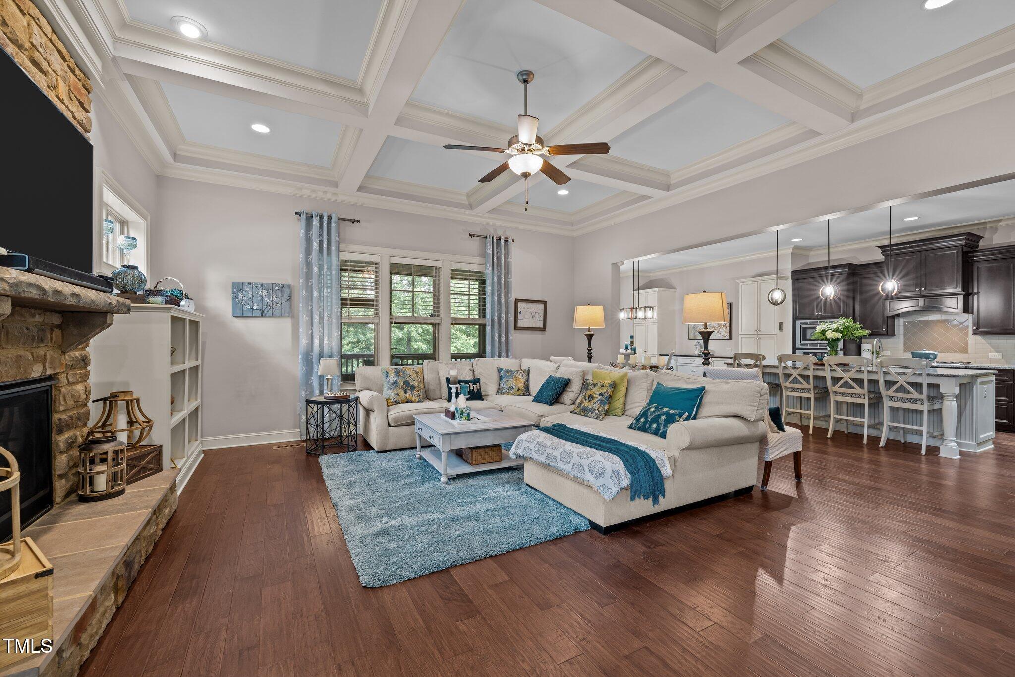 12216 Kyle Abbey Lane Raleigh, NC 27613 - Photo 2 of 60 a living room with furniture fireplace and flat screen tv