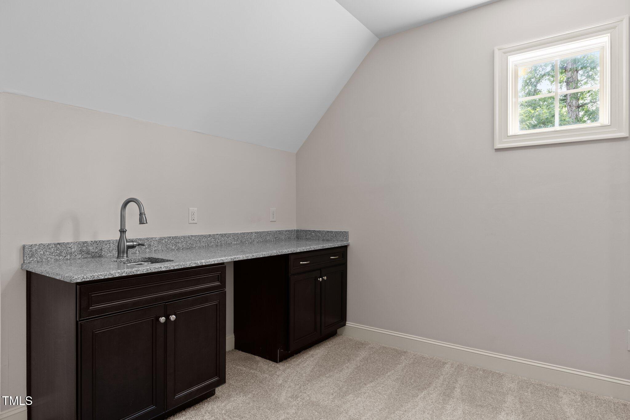 12216 Kyle Abbey Lane Raleigh, NC 27613 - Photo 32 of 60 a kitchen with a sink and a window