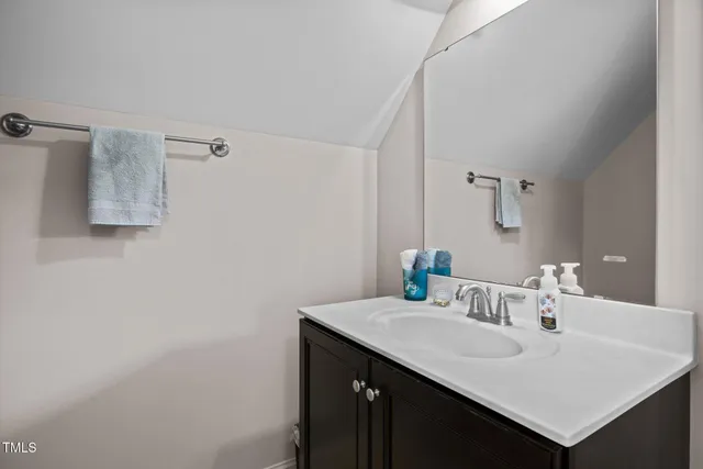 a close view of a sink and cabinets in the kitchen