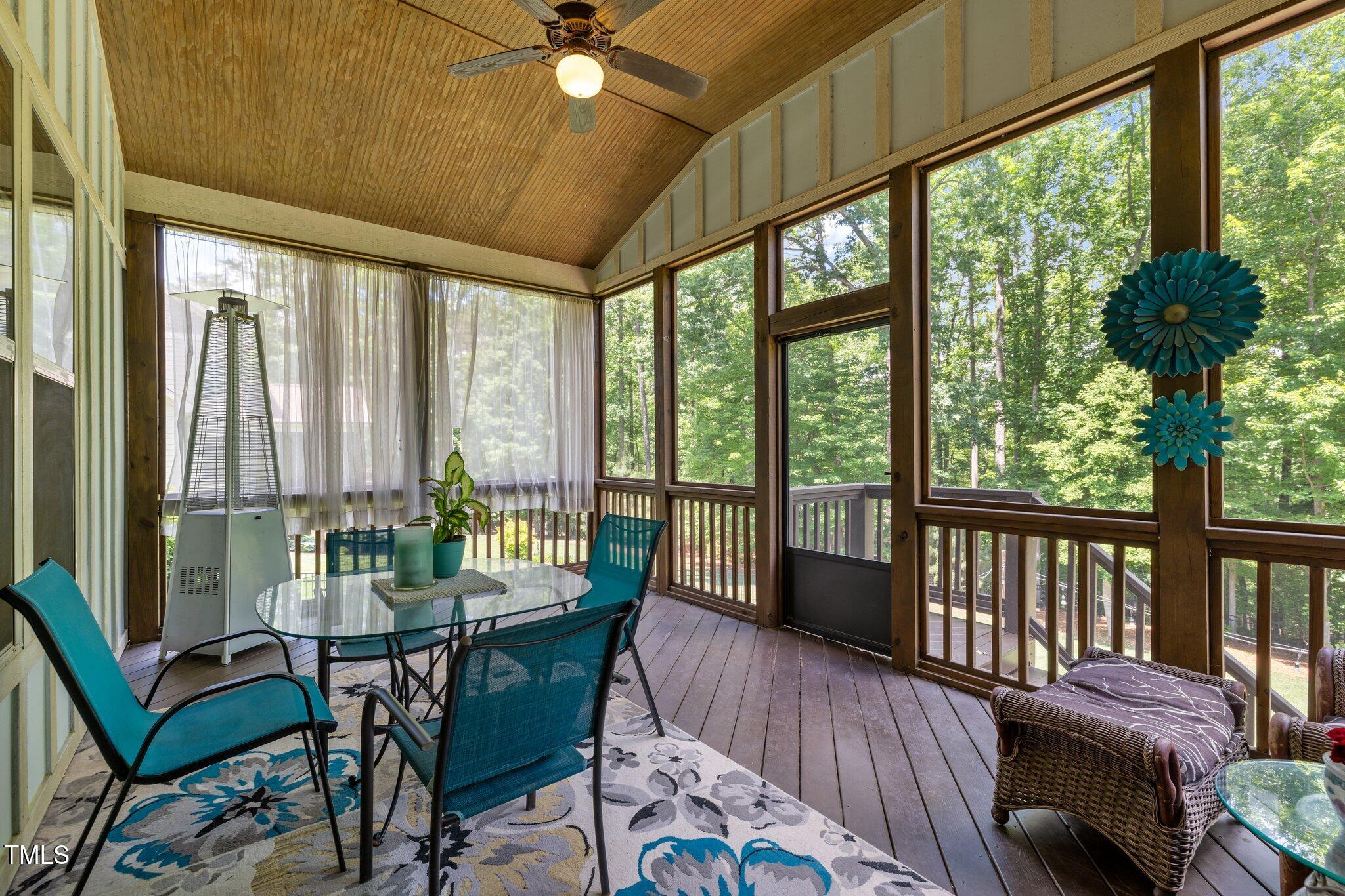 12216 Kyle Abbey Lane Raleigh, NC 27613 - Photo 36 of 60 a living room with furniture and a large window