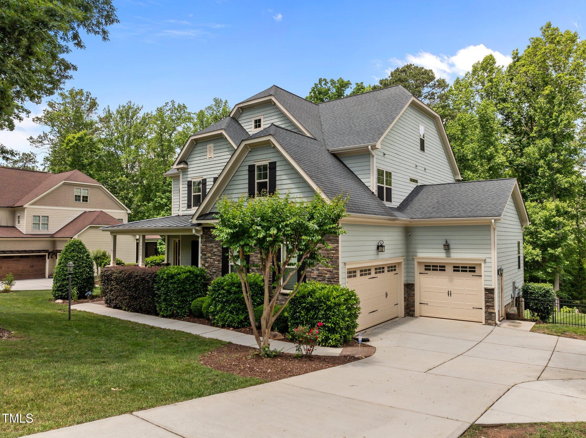 12216 Kyle Abbey Lane Raleigh, NC 27613 - Photo 37 of 60 a front view of a house with a yard