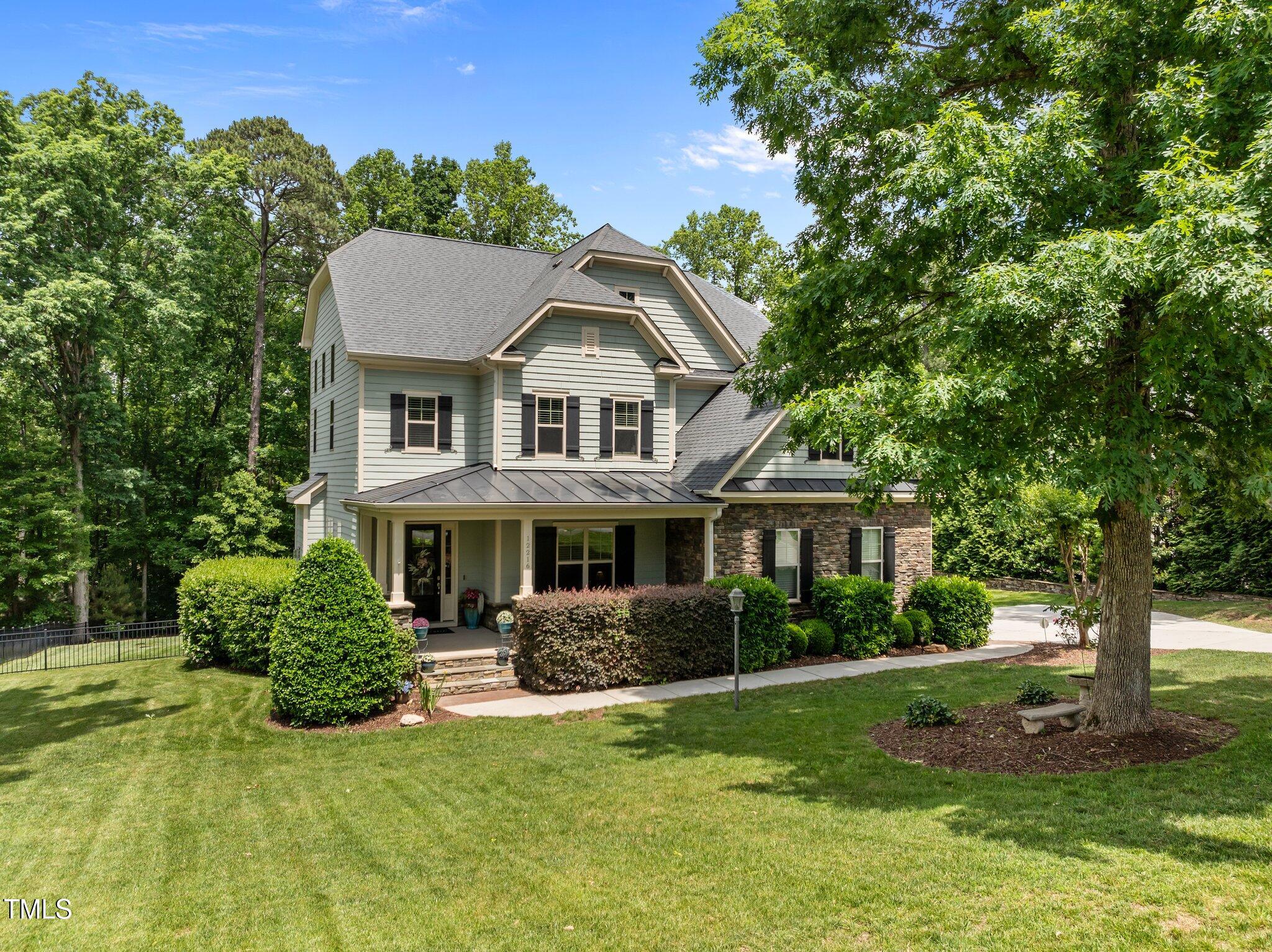 12216 Kyle Abbey Lane Raleigh, NC 27613 - Photo 38 of 60 a front view of a house with a yard