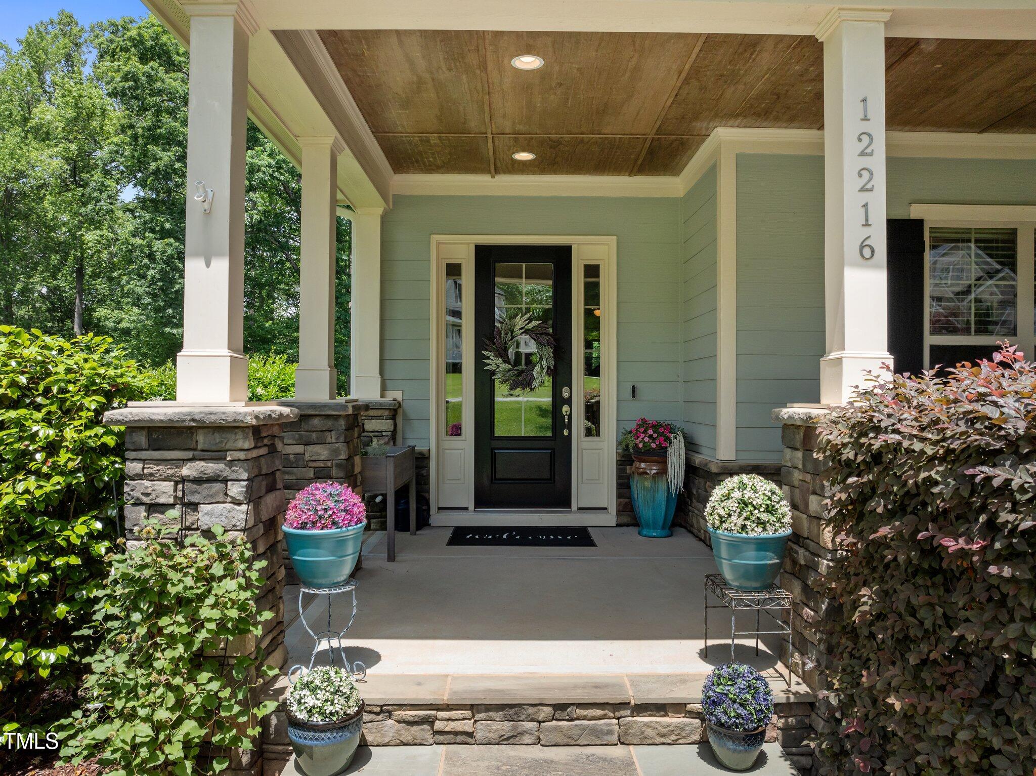 12216 Kyle Abbey Lane Raleigh, NC 27613 - Photo 39 of 60 a front view of a house with a porch