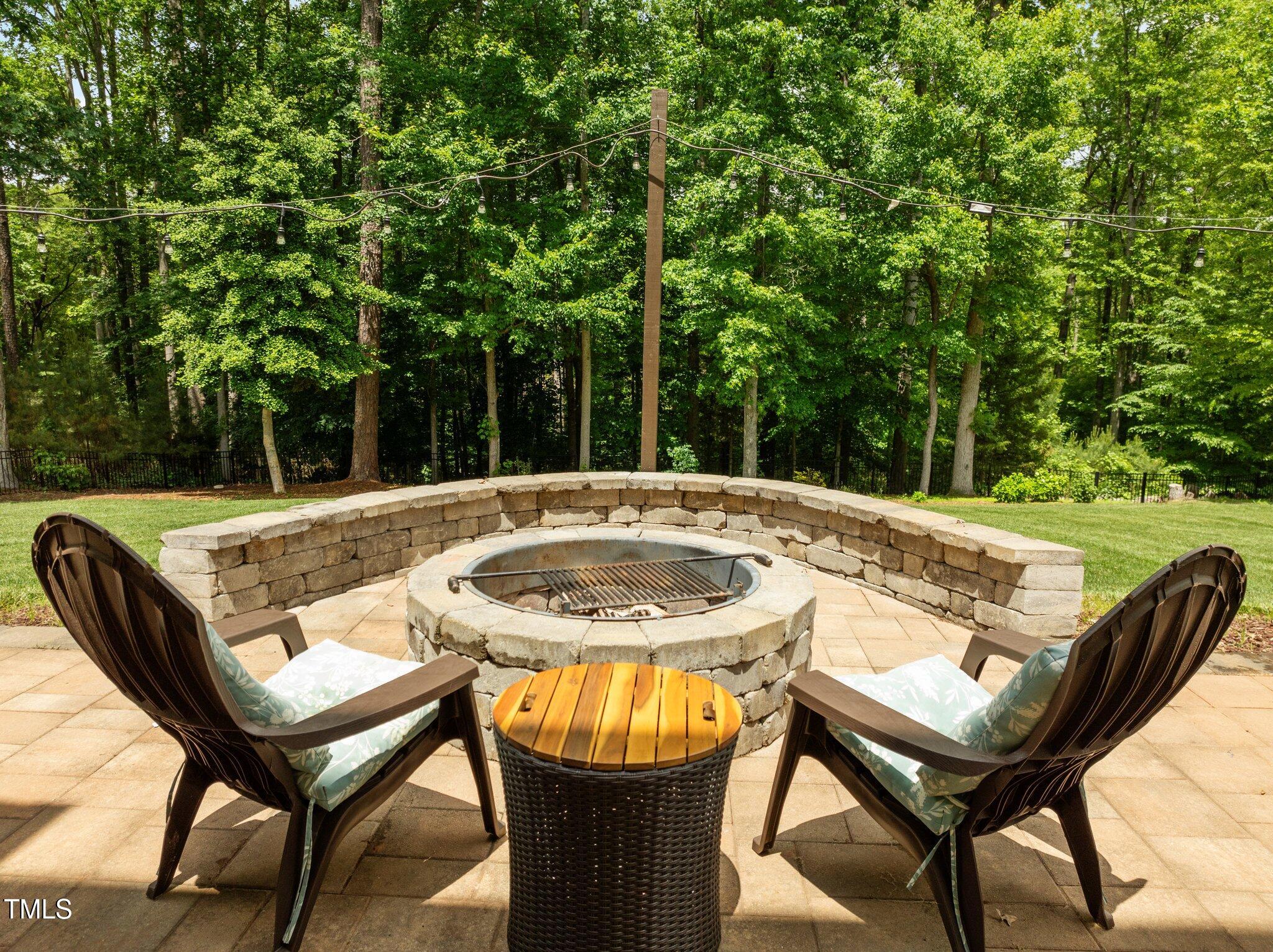 12216 Kyle Abbey Lane Raleigh, NC 27613 - Photo 43 of 60 a view of a swimming pool with a lounge chair