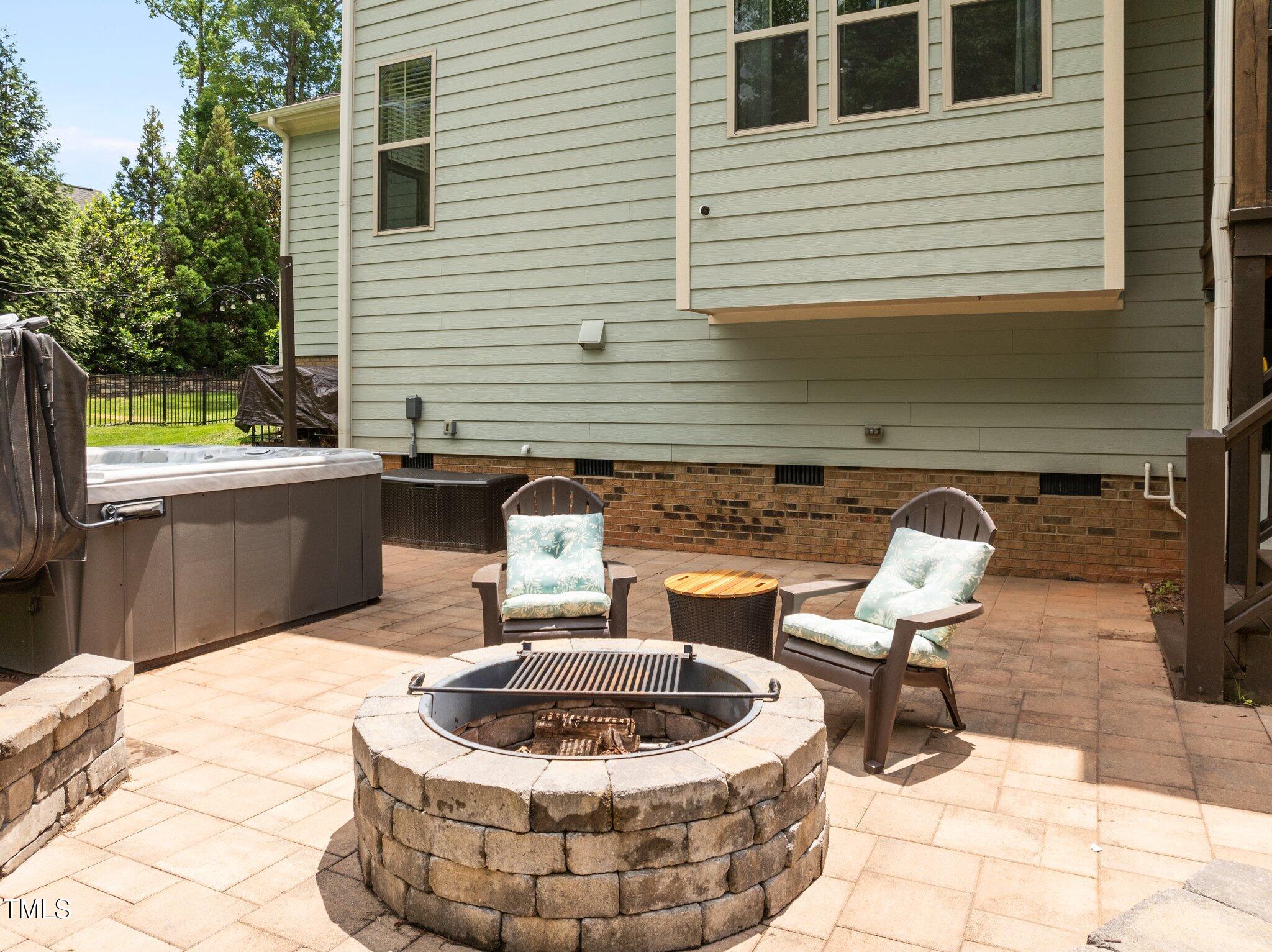 12216 Kyle Abbey Lane Raleigh, NC 27613 - Photo 44 of 60 a building outdoor space with patio furniture