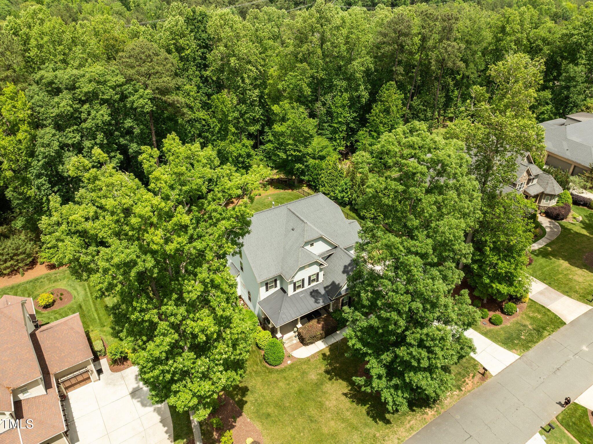 12216 Kyle Abbey Lane Raleigh, NC 27613 - Photo 50 of 60 an aerial view of a house with a yard and garden