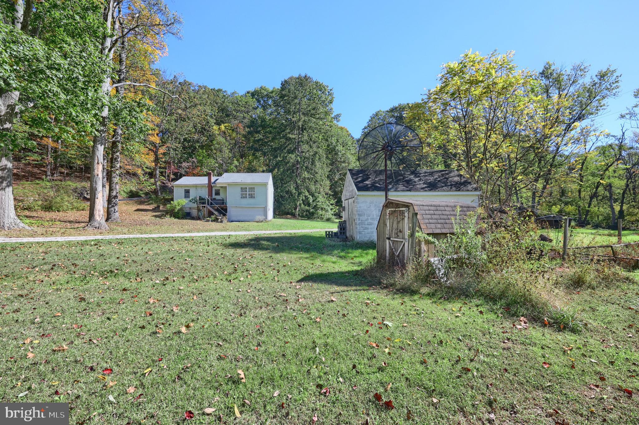 50 Bahns Mill Road Red Lion, PA 17356 - Photo 1 of 19 Charming countryside retreat with lush greenery.