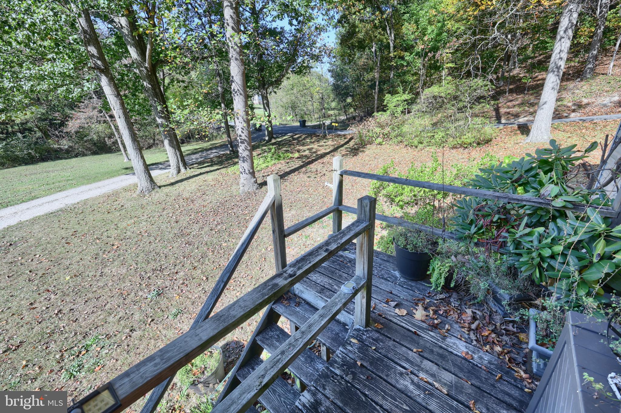 50 Bahns Mill Road Red Lion, PA 17356 - Photo 16 of 19 Serene steps leading to nature's embrace.