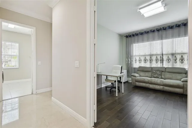 a kitchen with kitchen island granite countertop a sink counter top space appliances and cabinets