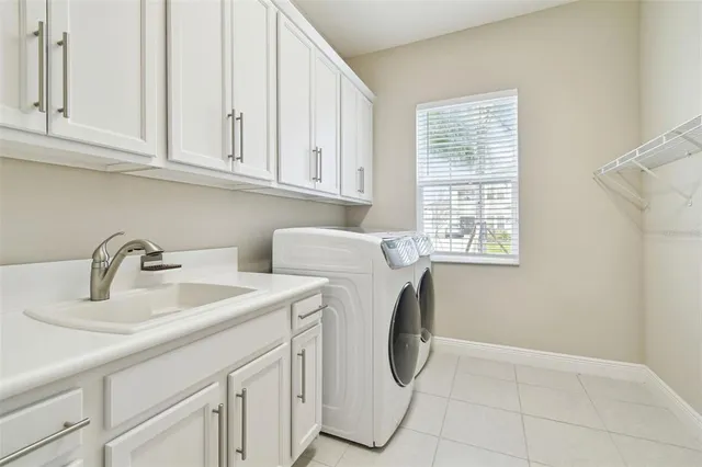 a kitchen with kitchen island granite countertop stainless steel appliances and wooden cabinets