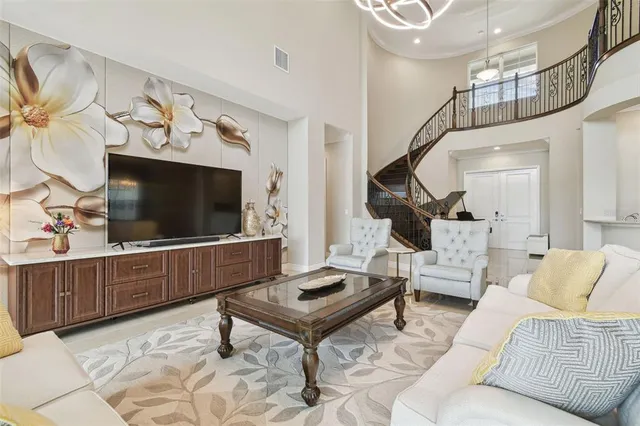 a bedroom with a bed and flat screen tv