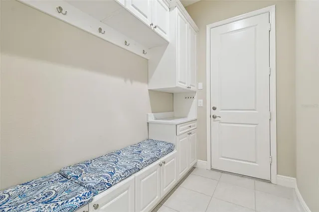 a spacious bathroom with a granite countertop sink a toilet and a mirror