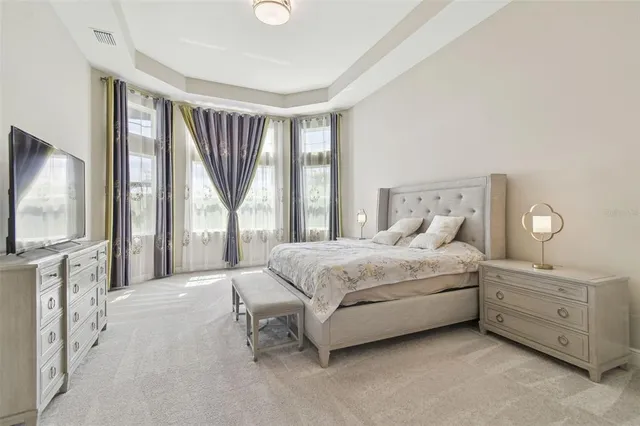 a bathroom with a granite countertop sink and a toilet