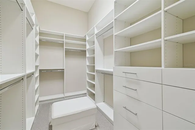 an aerial view of residential houses with outdoor space and swimming pool