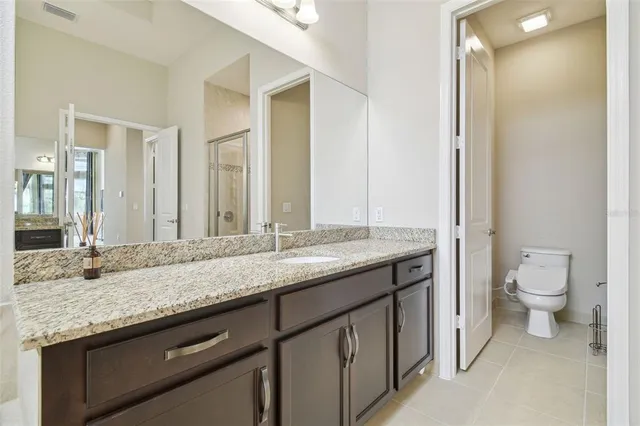 a view of a lake with couches chairs