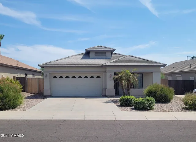 a front view of a house with a garage