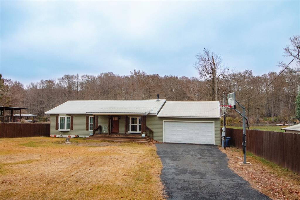 2693 Rhoda Road Shreveport, LA 71119 - Photo 1 of 35 a front view of a house with a yard