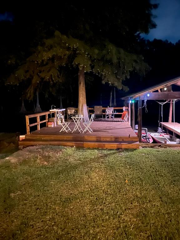 2693 Rhoda Road Shreveport, LA 71119 - Photo 36 of 39 a view of a backyard with table and chairs a barbeque grill and plants