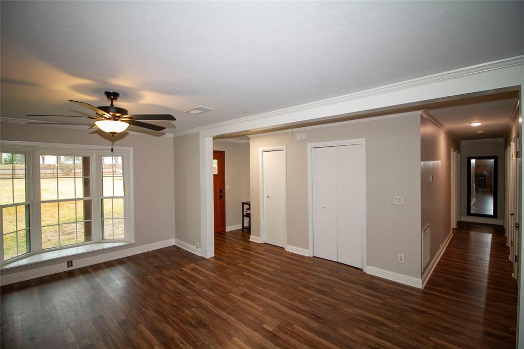 2693 Rhoda Road Shreveport, LA 71119 - Photo 7 of 35 a view of a livingroom with wooden floor and a ceiling fan