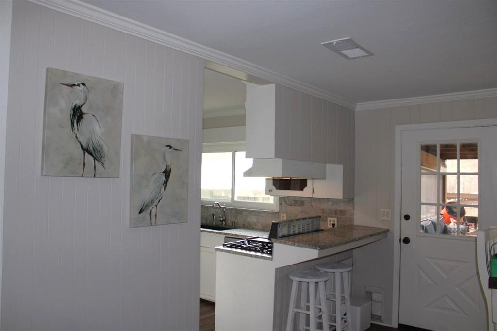 2693 Rhoda Road Shreveport, LA 71119 - Photo 8 of 35 a kitchen with stainless steel appliances granite countertop a stove and a refrigerator
