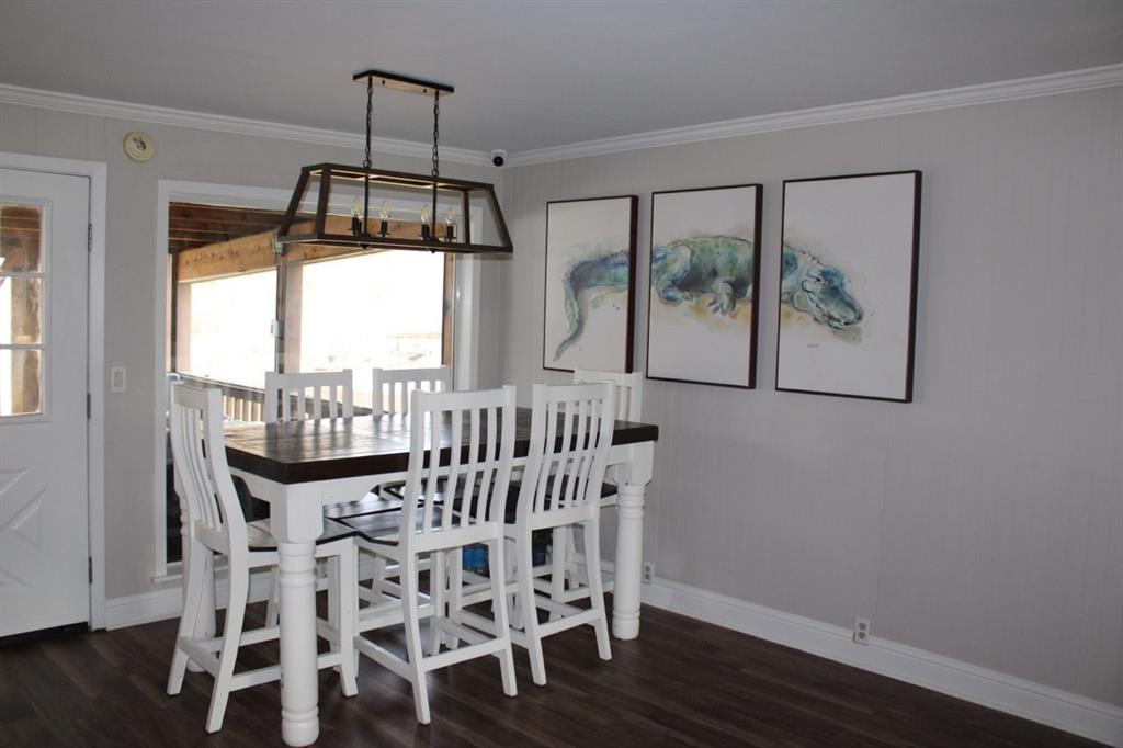 2693 Rhoda Road Shreveport, LA 71119 - Photo 10 of 39 a view of a dining room with furniture window and wooden floor