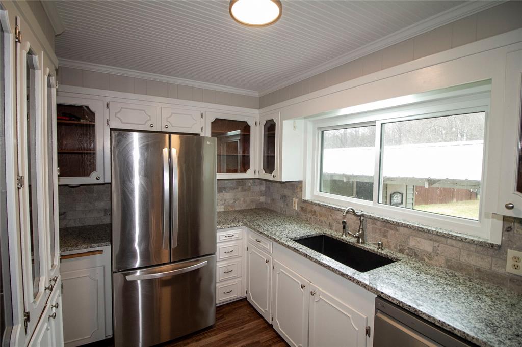2693 Rhoda Road Shreveport, LA 71119 - Photo 10 of 35 a kitchen with a refrigerator and a sink