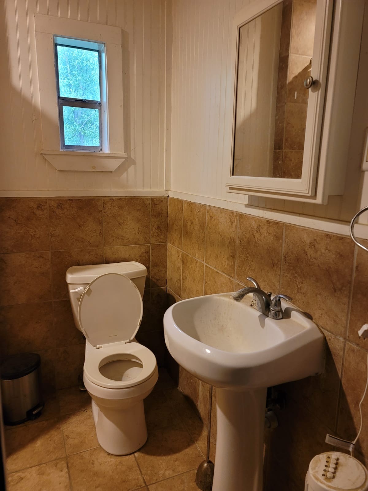 18327 Blake Manor Road, Unit A Manor, TX 78653 - Photo 14 of 21 Half bath with toilet and tile patterned floors