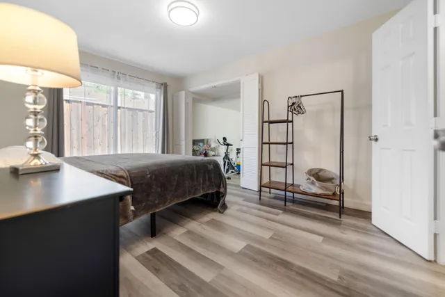 a bedroom with a bed and a table