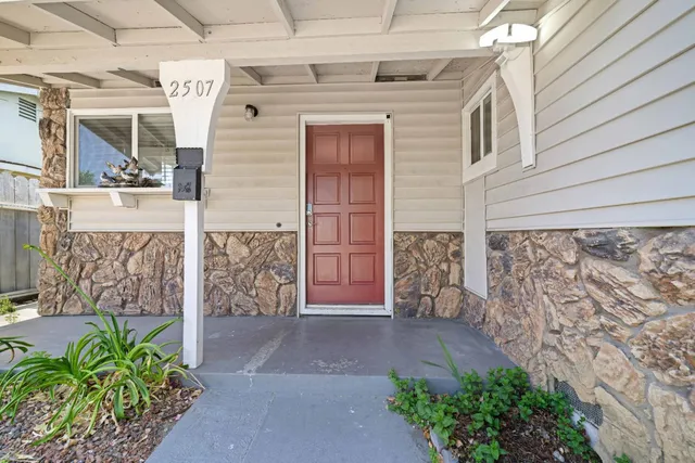 a view of front door of house with an outdoor space