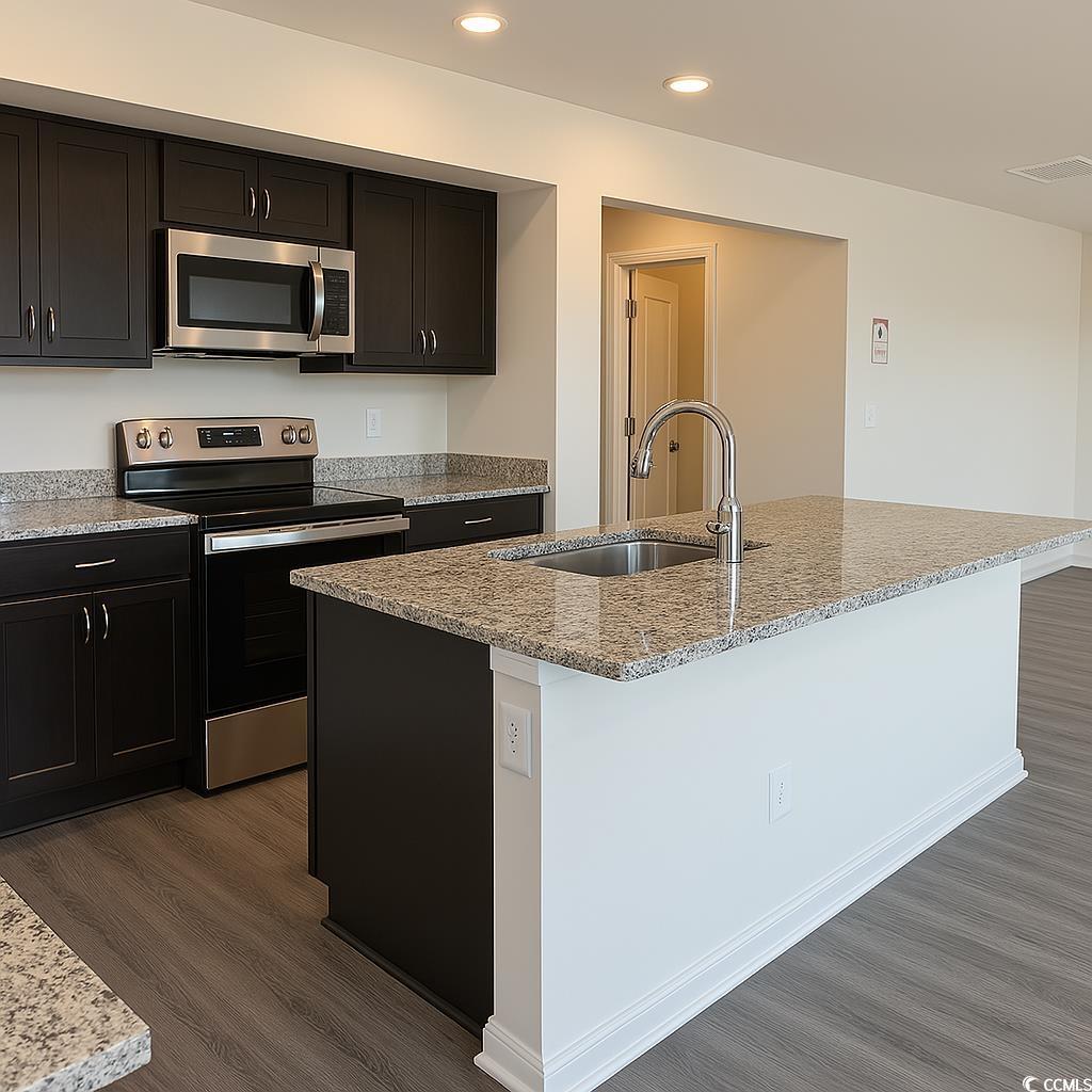 1486 Hardwick Road Conway, SC 29526 - Photo 5 of 8 Kitchen featuring LVP flooring, recessed lighting,