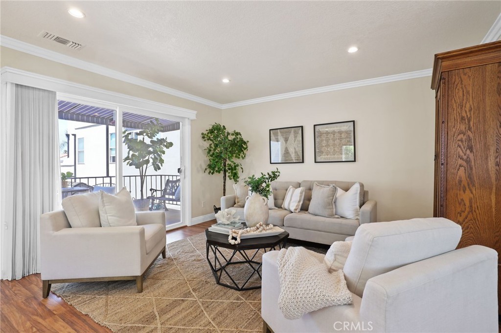 222 8th Street Seal Beach, CA 90740 - Photo 28 of 41 slidi8ng door off upper apartment to the private patio.