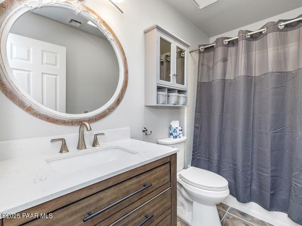 1034 Bunker Place Dewey, AZ 86327 - Photo 14 of 17 a bathroom with a sink a toilet and shower