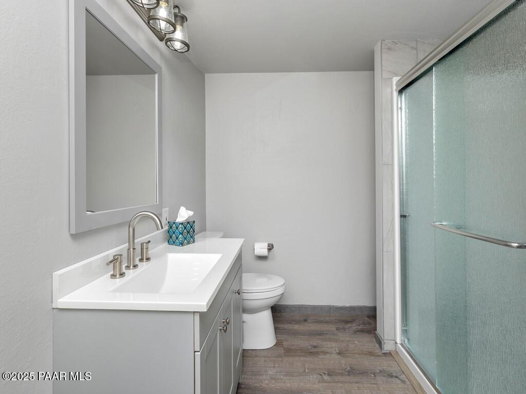 1034 Bunker Place Dewey, AZ 86327 - Photo 16 of 17 a bathroom with a sink toilet and a mirror