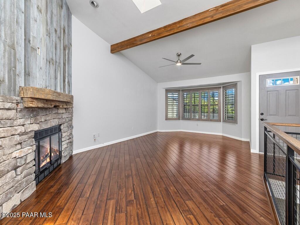 1034 Bunker Place Dewey, AZ 86327 - Photo 5 of 17 a view of an empty room with wooden floor and a window