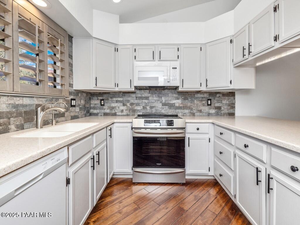 1034 Bunker Place Dewey, AZ 86327 - Photo 9 of 17 a kitchen with stainless steel appliances granite countertop a sink stove and cabinets
