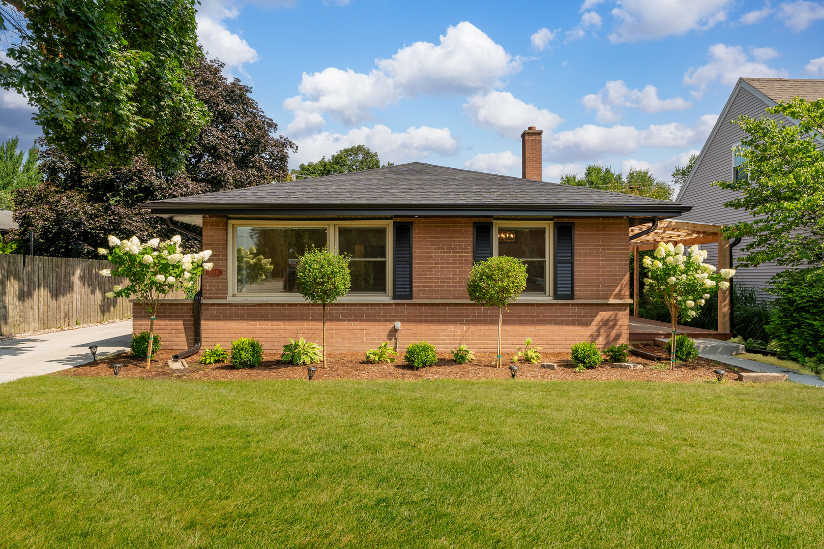 208 47th Street Western Springs, IL 60558 - Photo 1 of 53 a front view of a house with a yard