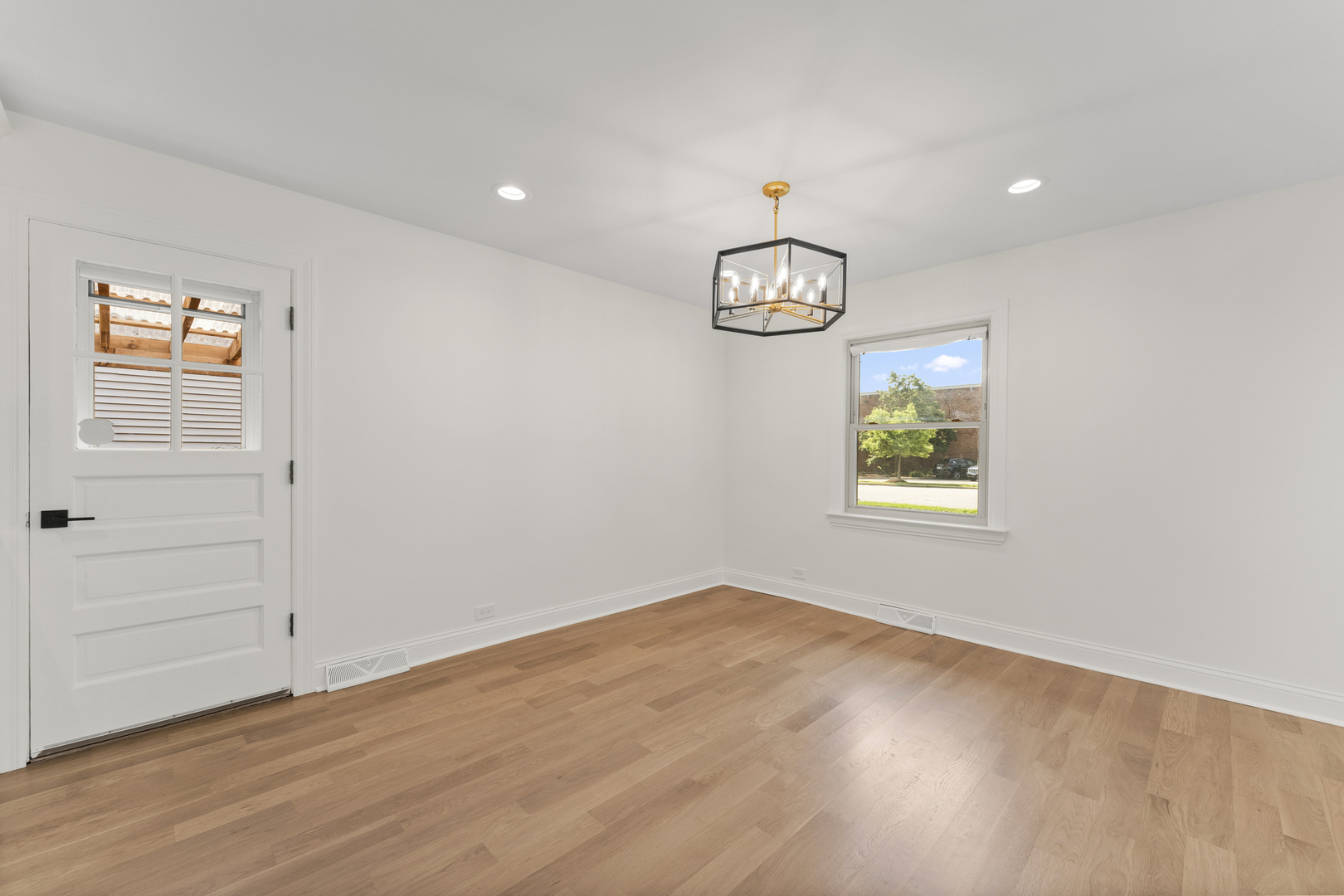 208 47th Street Western Springs, IL 60558 - Photo 14 of 53 an empty room with window and wooden floor